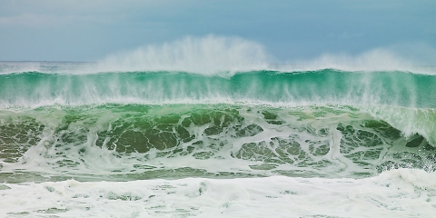 Ocean waves, stormy seascapes, sandy beaches, blues and greens , foam and wave spray,  rolling waves, see through waves, black storm clouds, hurricane Baja waves, Mexican seascapes.